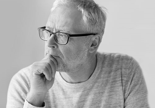 Thoughtful man looking left